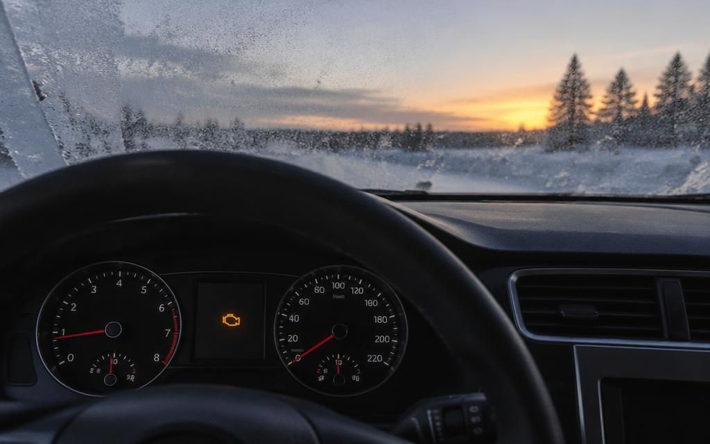 Dashboard with the check engine light on during a cold Moose Jaw morning